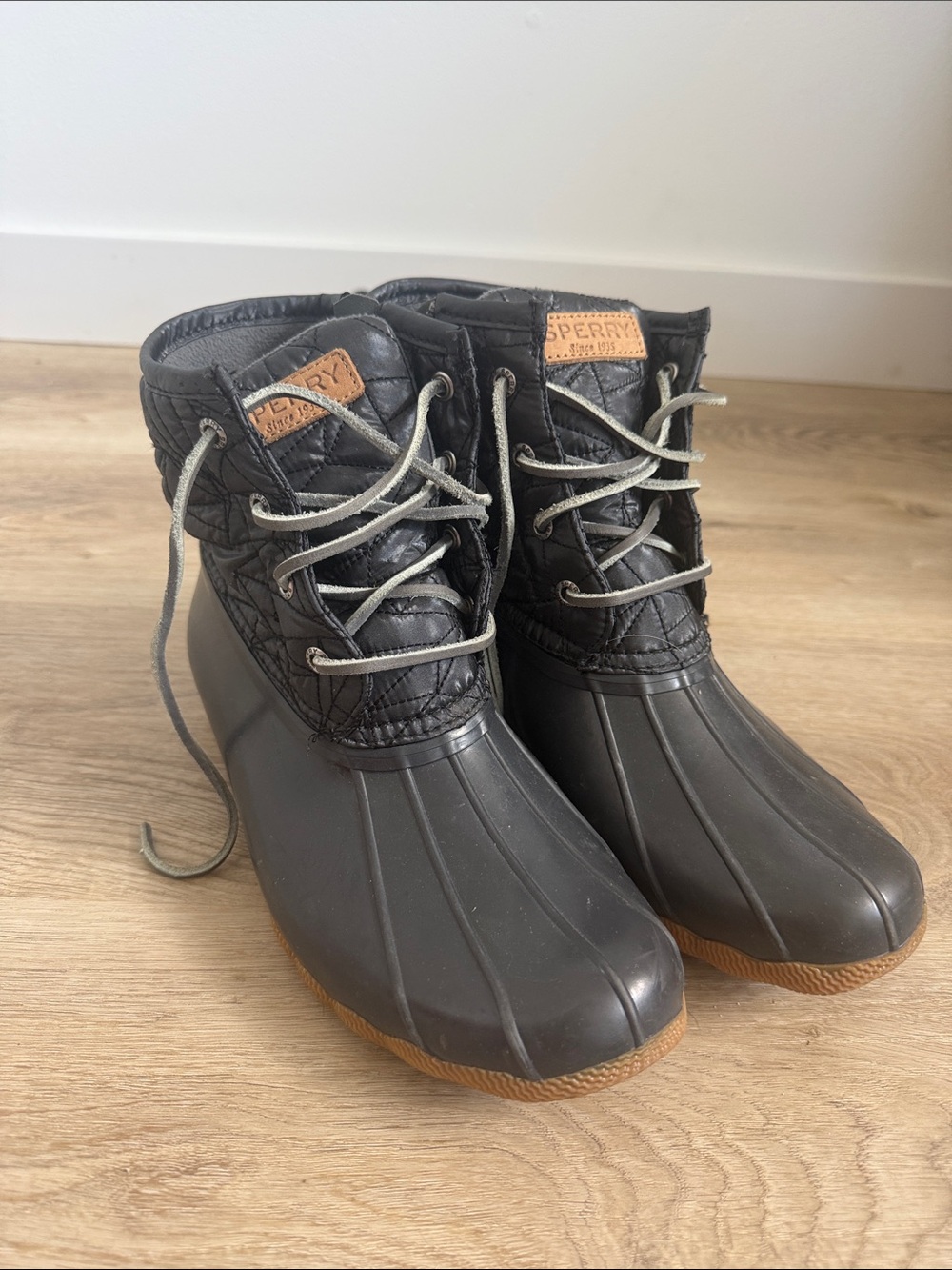 Sperry Black Quilted Lace-Up Duck Boots with Tan Logo Patch